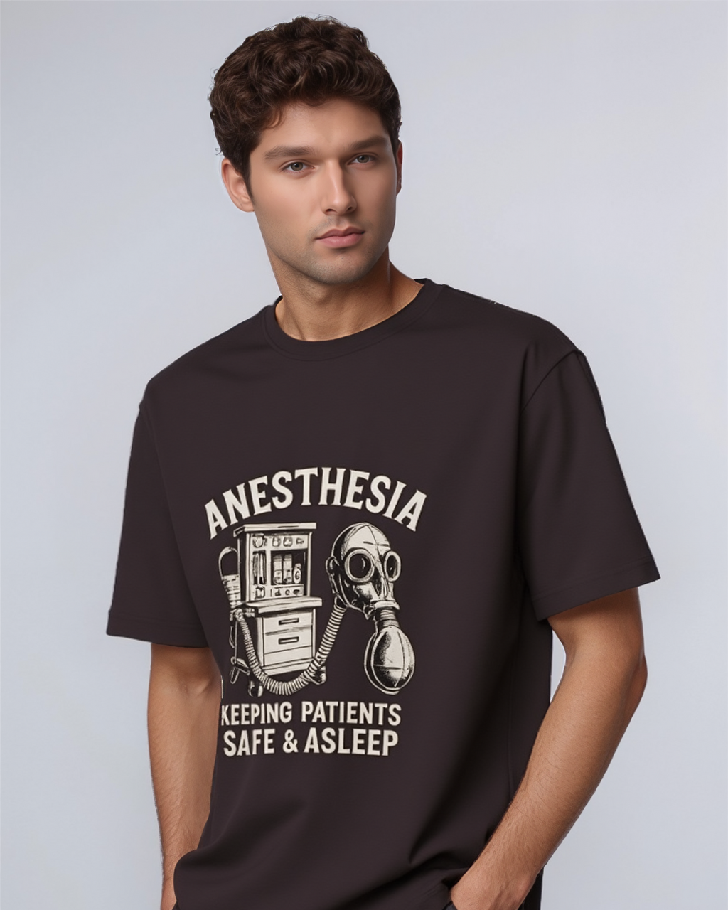 Man wearing a black t-shirt with an anesthesia graphic and text on a light gray background