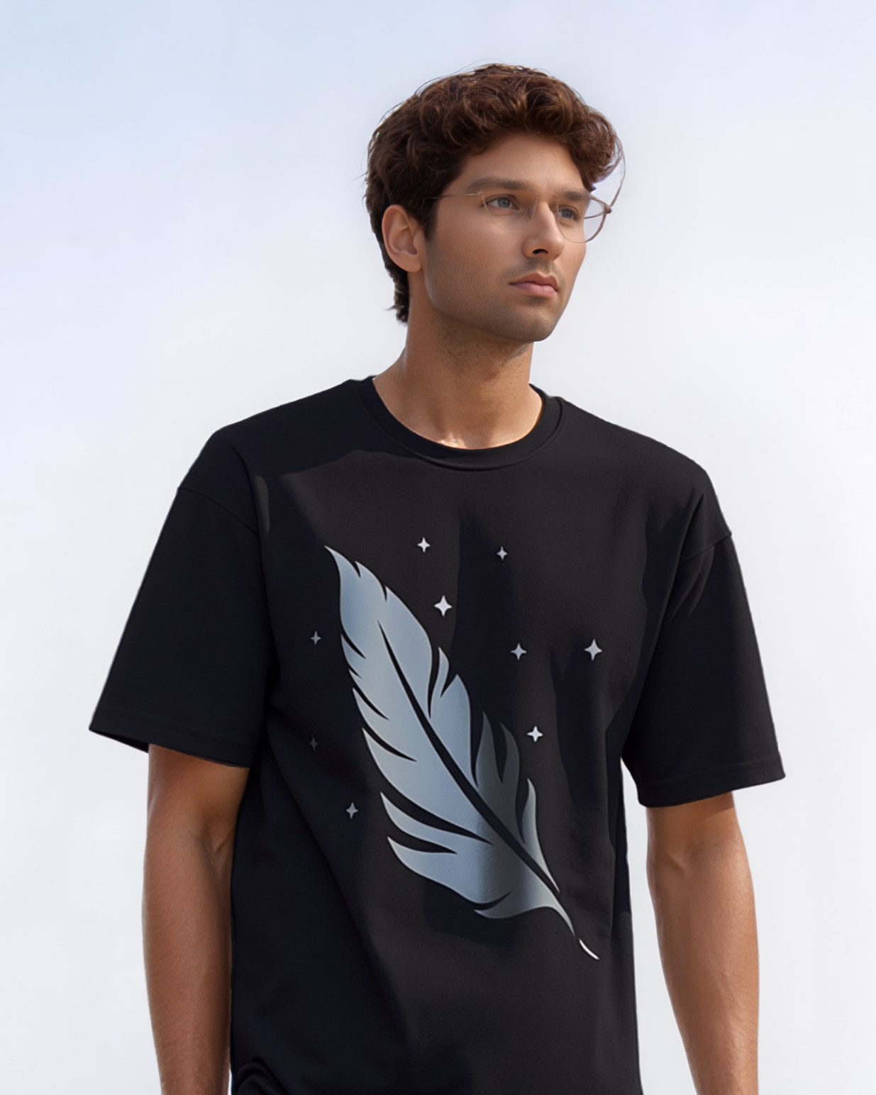 Man wearing a black t-shirt with a feather design on a white background