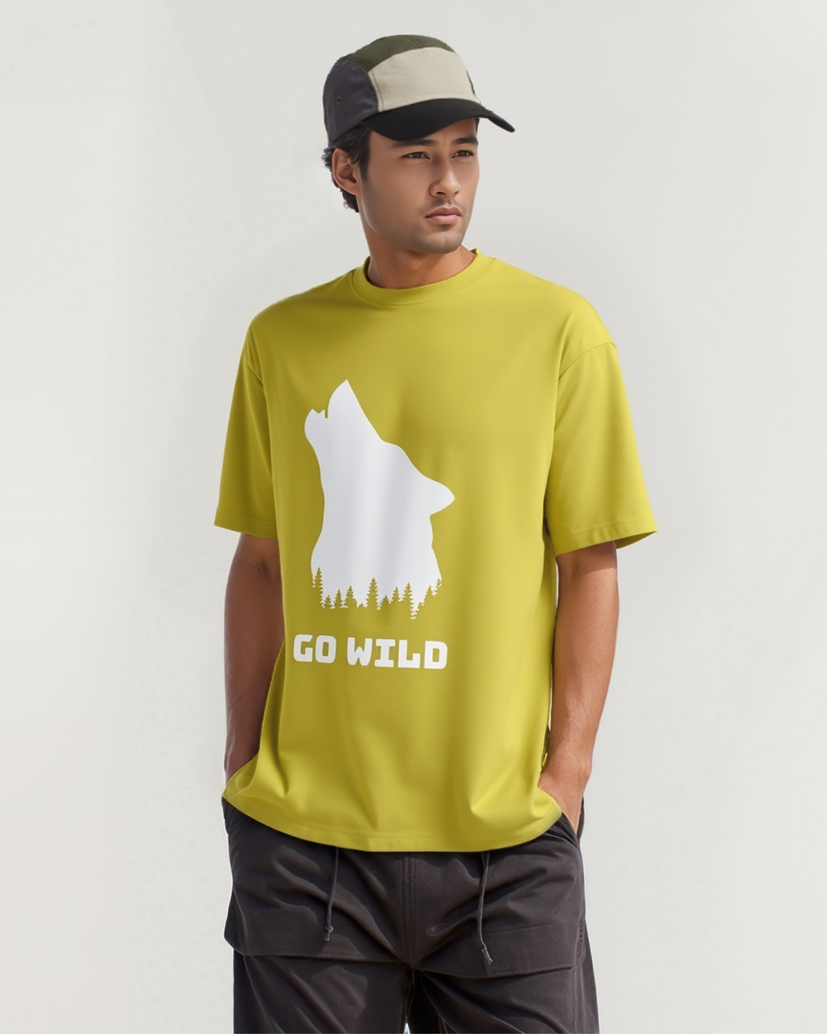 Man wearing a green t-shirt with a bear graphic and 'GO WILD' text, standing against a plain background.
