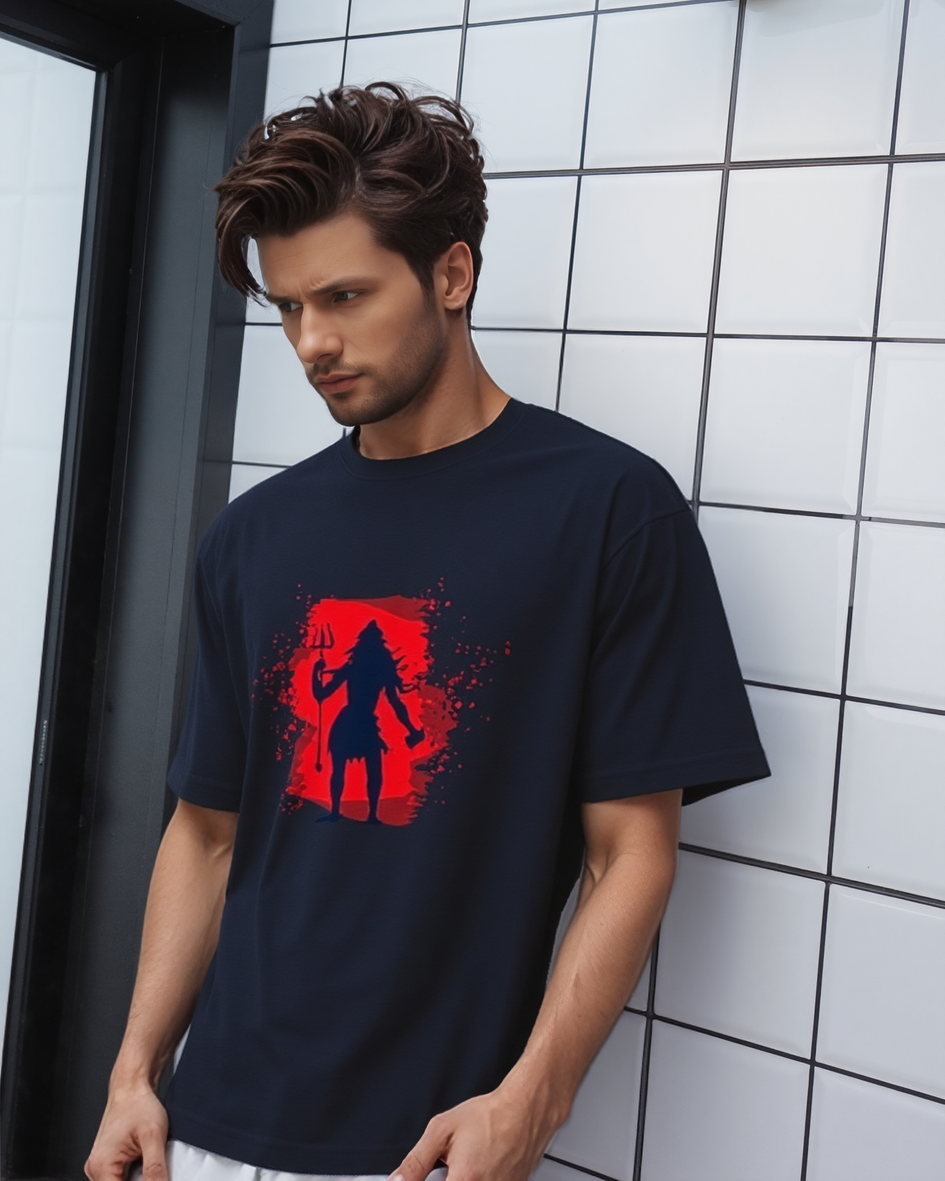 Man wearing a black t-shirt with a red graphic design in a bathroom.