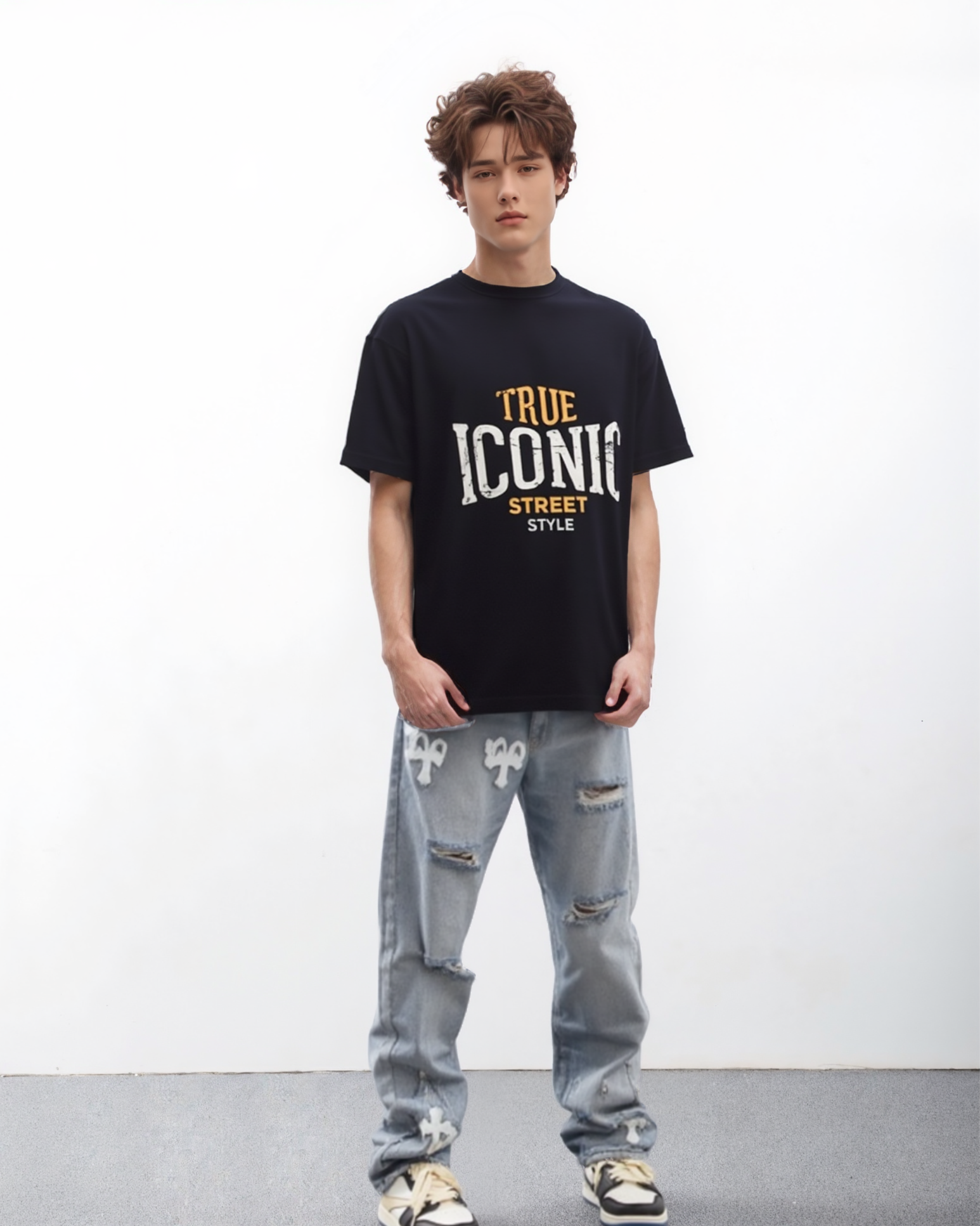 Person wearing a black t-shirt with 'True Iconic Street Style' text and ripped jeans on a white background